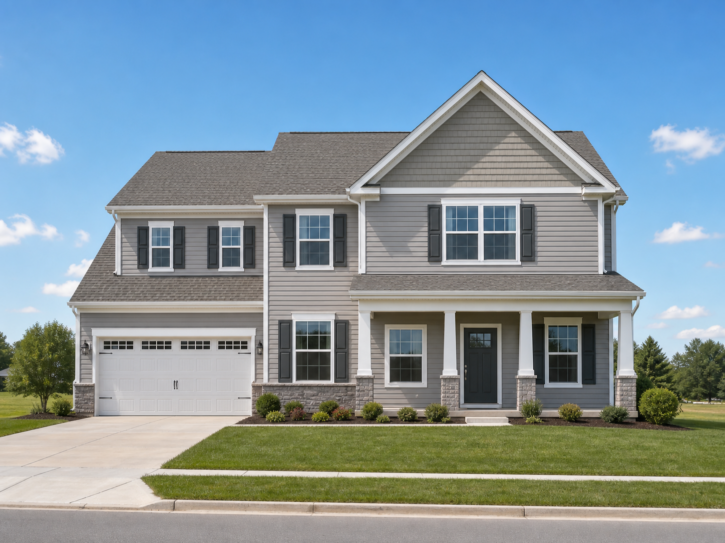 Two-story suburban home with several visible asphalt-shingle gable roof planes